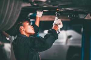garage-women-worker-mechanic-team-working-car-auto-service-fix-replace-car-lift-hoist